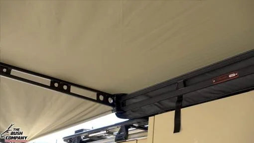 Close-up of a tent roof with a metal bracket and 'The Bush Company' logo.