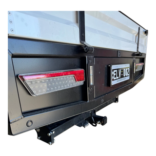 Trailer hitch with reflective elements on a white background – Dual Cab 1800mm Aluminium Tray with 1m Trundle Drawer 50L Water tank & Colour Coded Tray Sides