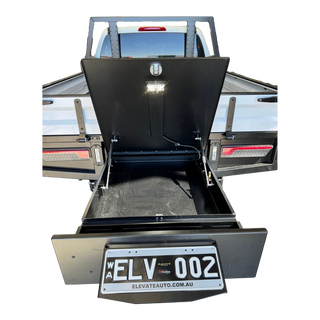 Open truck bed with black toolbox and 'ELV 002' license plate on a white background – Dual Cab 1800mm Aluminium Tray with 1m Trundle Drawer 50L Water tank & Colour Coded Tray Sides