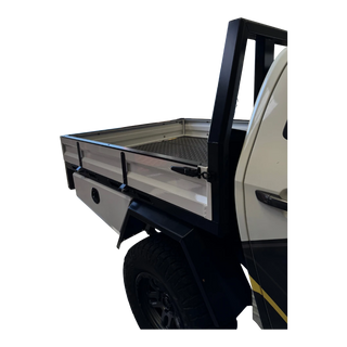 Side view of a truck with an open bed on a white background – Dual Cab 1800mm Aluminium Tray with 1m Trundle Drawer 50L Water tank & Colour Coded Tray Sides