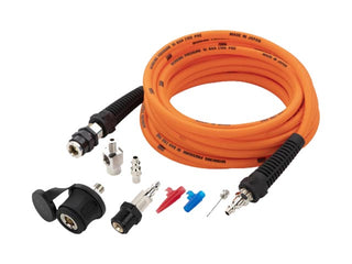The same ARB pump up kit shown from a lower angle, the coiled orange hose behind the couplings, adaptors, deflators and chuck