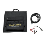 Foldable solar panel on a grassy background with 'Elevate Automotive' branding, jump leads, and cable on a white background