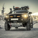 Toyota truck with off-road equipment in a snowy landscape