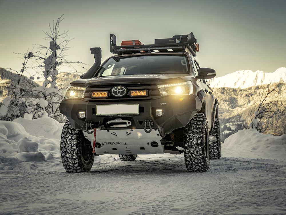 Toyota truck with off-road equipment in a snowy landscape