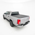 Silver pickup truck with a tonneau cover on a white background
