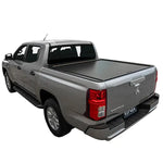 Gray pickup truck with a tonneau cover on a white background