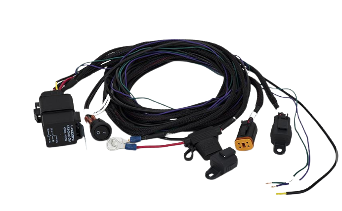 An assortment of Lazerlamps wiring kits including various connectors, cables, a relay, and fuses.