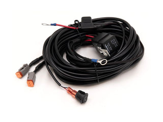Coiled wiring harness with connectors on a white background
