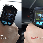 Comparison of a digital thermometer held by a hand with and without Snap Shades in a car interior.