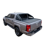 Gray pickup truck with a tonneau cover on a white background
