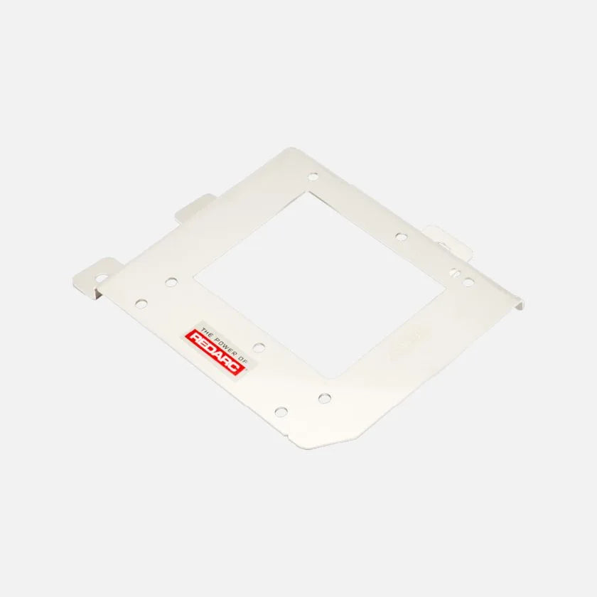 White Redarc mounting bracket lying flat, a wide plate with a square cut-out, folded tabs along two edges and fixing holes around the perimeter