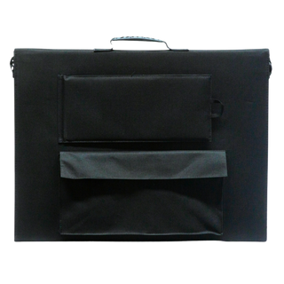 Back of the folded solar blanket, showing the carry handle, the shoulder strap anchors, the zipped cable pocket and the flap that covers it