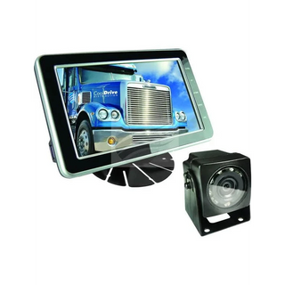 Reverse camera system: a 5 inch widescreen monitor on a stand with menu buttons down the right edge showing a demonstration image, beside a black weatherproof camera with an infrared LED ring around the lens and a mounting bracket on its base
