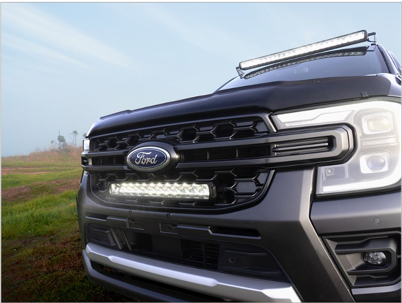 Ford truck with LED lights on a grassy field
