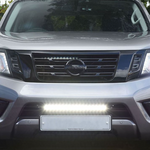 Front view of a silver Nissan vehicle with headlights on with Lazer Lamps Nissan Navara (2014-2021) Kit