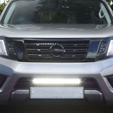 Front view of a silver Nissan vehicle with headlights on with Lazer Lamps Nissan Navara (2014-2021) Kit