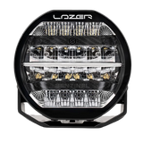 A black 7-inch Lazerlamps Sentinel LED driving light with a clear polycarbonate lens, designed for vehicles or tight mounting setups, featuring advanced LED technology.