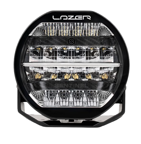 A black 7-inch Lazerlamps Sentinel LED driving light with a clear polycarbonate lens, designed for vehicles or tight mounting setups, featuring advanced LED technology.