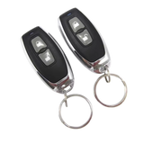 Two car remote keyfobs with keychains on a white background