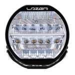A black 7-inch Lazerlamps Sentinel LED driving light with a clear polycarbonate lens, designed for vehicles or tight mounting setups, featuring advanced LED technology.