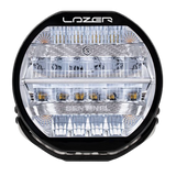 A black 7-inch Lazerlamps Sentinel LED driving light with a clear polycarbonate lens, designed for vehicles or tight mounting setups, featuring advanced LED technology.
