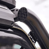 Roof rack system on a vehicle with visible brand logo.