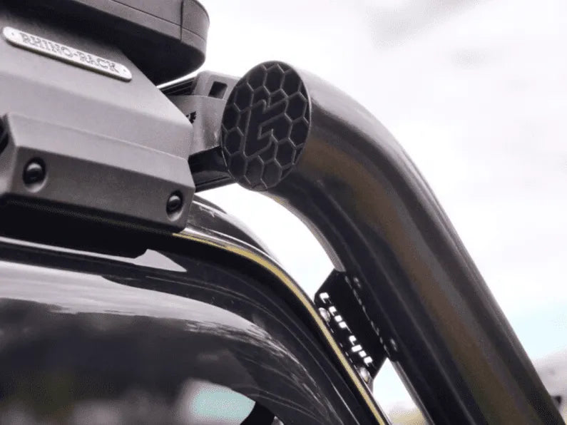 Roof rack system on a vehicle with visible brand logo.