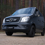 Black Mercedes-Benz van with 'Lozer' branding on a road with trees in the background with Lazer Lamps Mercedes Sprinter (2013-2017) Grille Kit