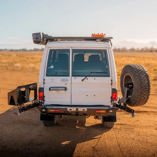 White Toyota Land Cruiser in a desert setting with TCC 78 Series Troopcarrier Rear Bar Tow Bar.