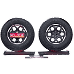 Two tires with rims on a white background