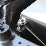 Close-up of a metal bolt and washer on a mechanical component.