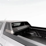 Close-up of a truck bed with a tonneau cover on a white background