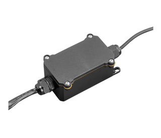 Sealed control box for the rock light kit, a black moulded housing with a screwed-down lid, an orange gasket line around the seam, cable glands at each end and a mounting lug on one corner
