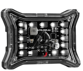 ALTIQ Spectrum Pro rock light face on, the clear lens over the LED board with the numbered LED positions, the inductor marked 560 and the 47 microfarad 35 volt capacitor visible