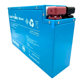 Amptron slimline BluEdge battery at a three-quarter angle, a tall narrow blue aluminium case with the red and black terminal covers and a communication port grouped at the top of one end