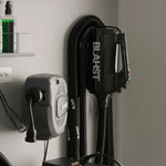 Blahst air maxx dryer and attachments mounted on a wall.