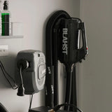 Blahst air maxx dryer and attachments mounted on a wall.
