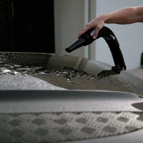 Person using a Air Maxx Dryer to dry a car's bonnet
