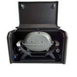 Portable grill in a black carrying case on a white background