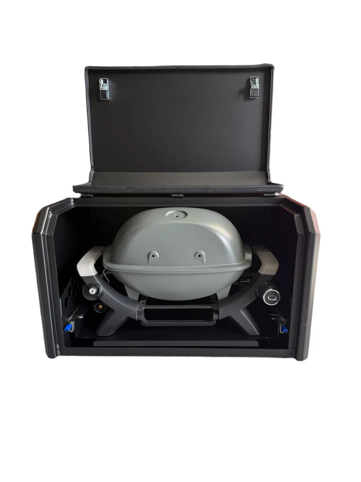 Portable grill in a black carrying case on a white background