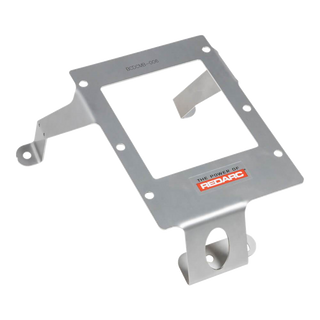 Stainless Redarc mounting bracket marked BCDCMB-006, a plate with a large rectangular cut-out, a folded retaining tang and two mounting feet, one with a large round hole