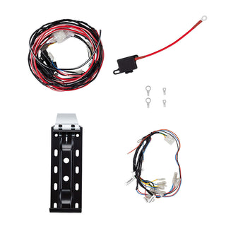 The compressor fitting kit laid out: the main wiring loom, a battery lead with in-line fuse holder and ring terminal, four ring terminals, the black powder-coated mounting bracket and the switch harness with its labelled tails