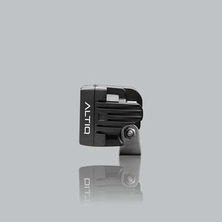 ALTIQ CX4 work light seen from the side, the ribbed black housing with the ALTIQ name down the face and the stainless mounting bracket below