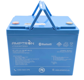 Amptron AT-LFP-12-100-BT-BV13 battery face on with the carry handle raised, the label listing 1280Wh, 12.8 volts, 100Ah, max charge voltage 14.6V, standard charge current 20A, max continuous charge 100A, max continuous discharge 200A, peak discharge 400A, parallel connections yes and series connections up to four