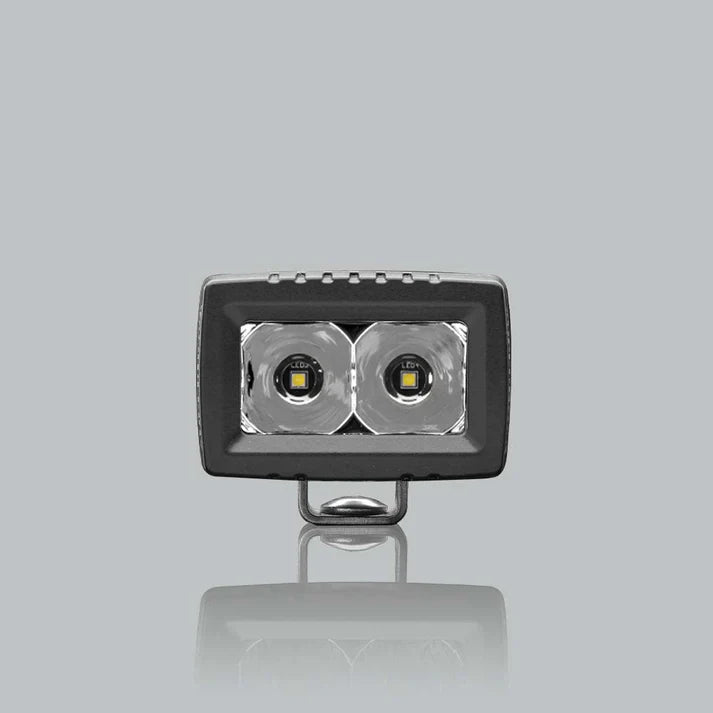 ALTIQ CX2 spot work light square on to the lens, the two deep polished spot reflectors filling the aperture with the mounting bracket beneath