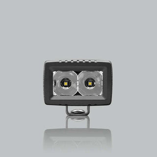 ALTIQ CX2 spot work light square on to the lens, the two deep polished spot reflectors filling the aperture with the mounting bracket beneath