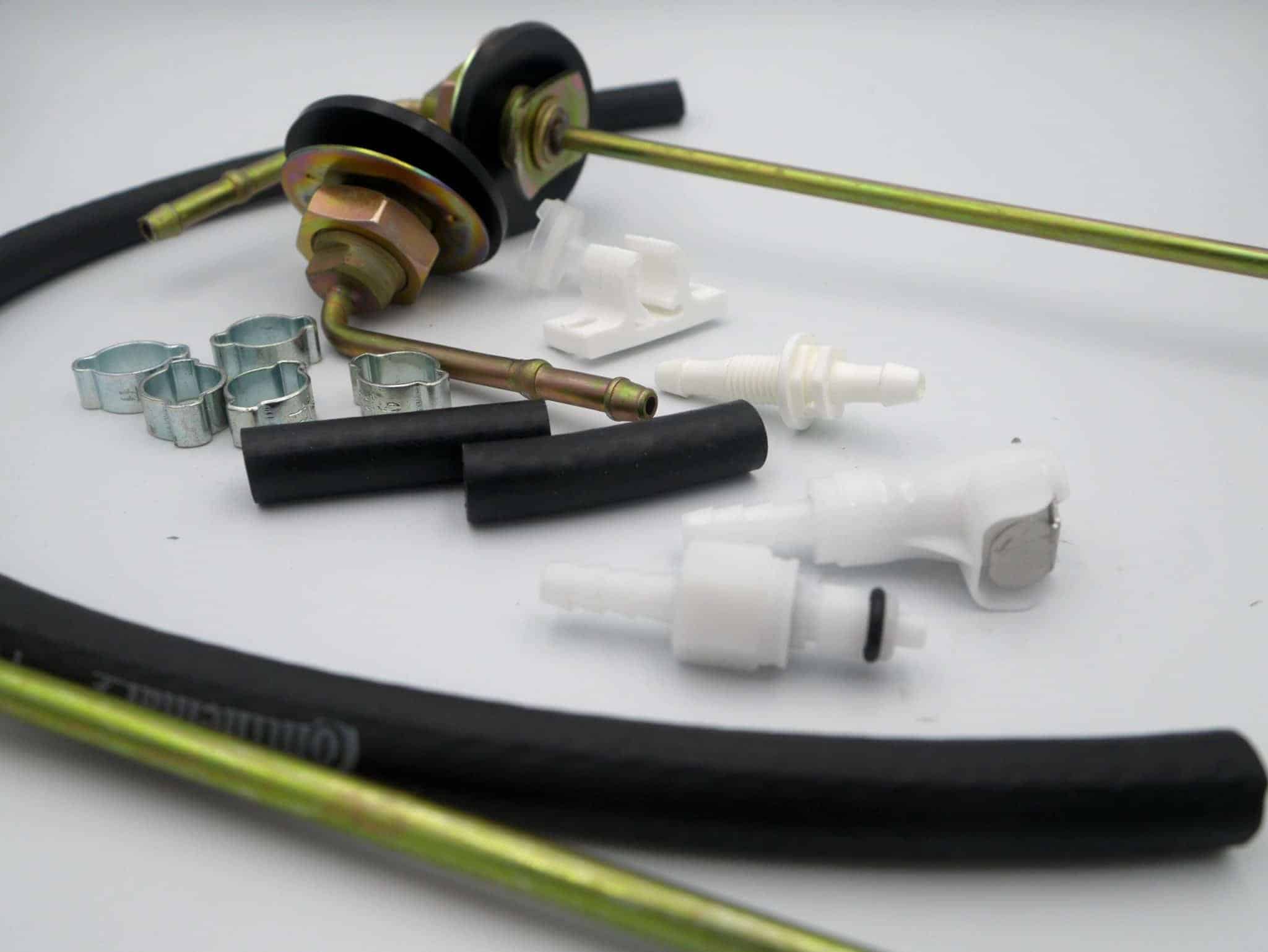 Mechanical parts including hoses and connectors on a white background