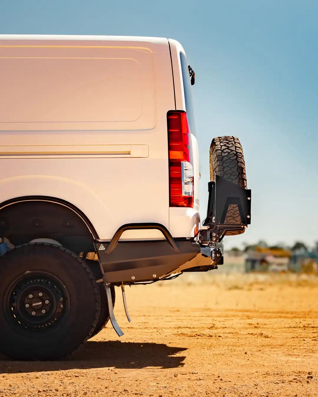side view of a white van with TCC Toyota Hiace 300 Series Rear Bar