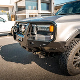 Silver SUV with a front bumper in an urban setting