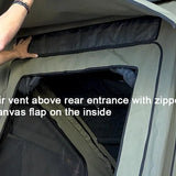 Air vent above rear entrance with zipped canvas flap on a tent